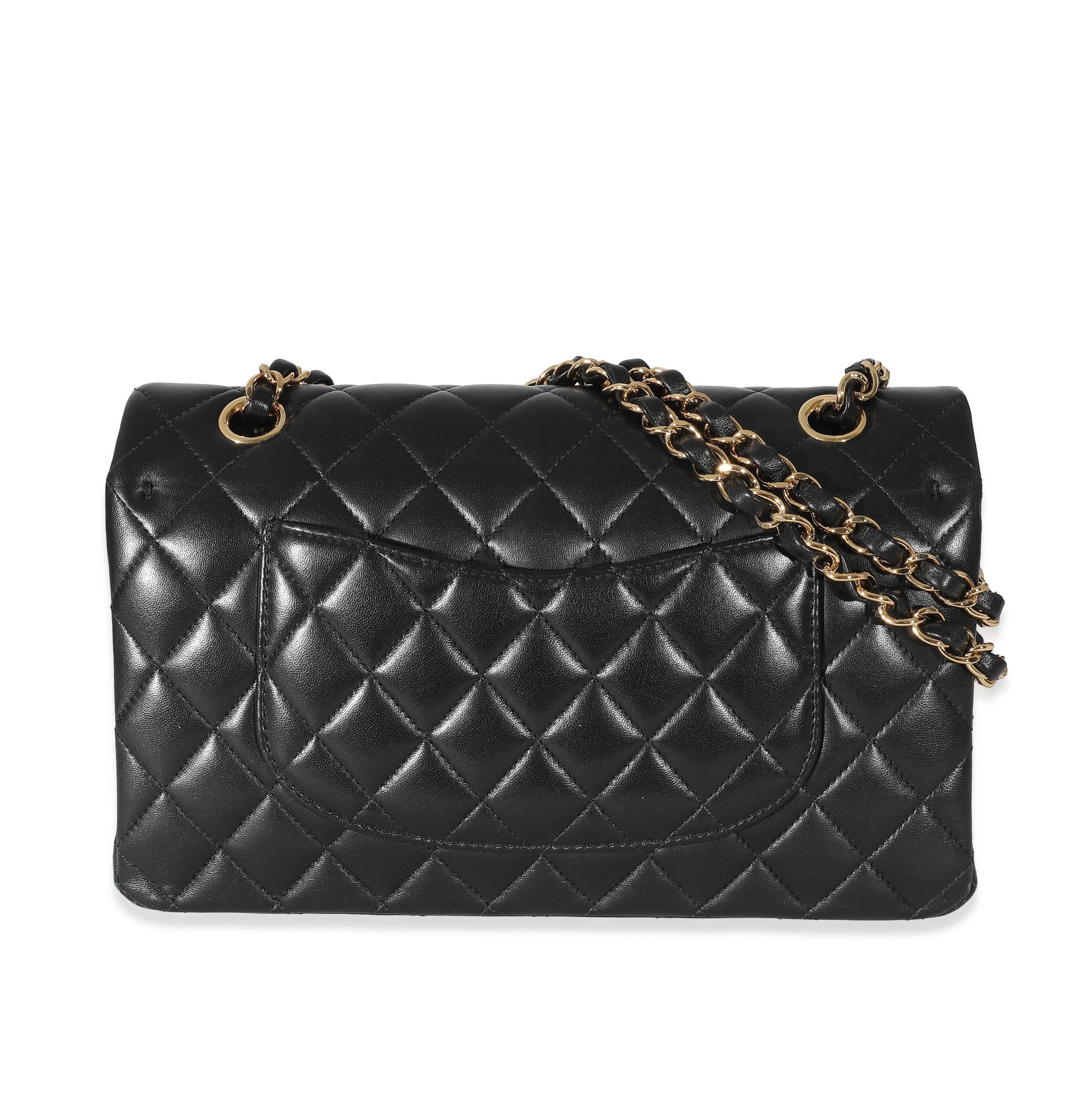 Listing Title: Chanel Black Quilted Lambskin Medium Classic Double Flap Bag
SKU: 134176
MSRP: 10200.00 USD
Condition: Pre-owned 
Condition Description: A timeless classic that never goes out of style, the flap bag from Chanel dates back to 1955 and