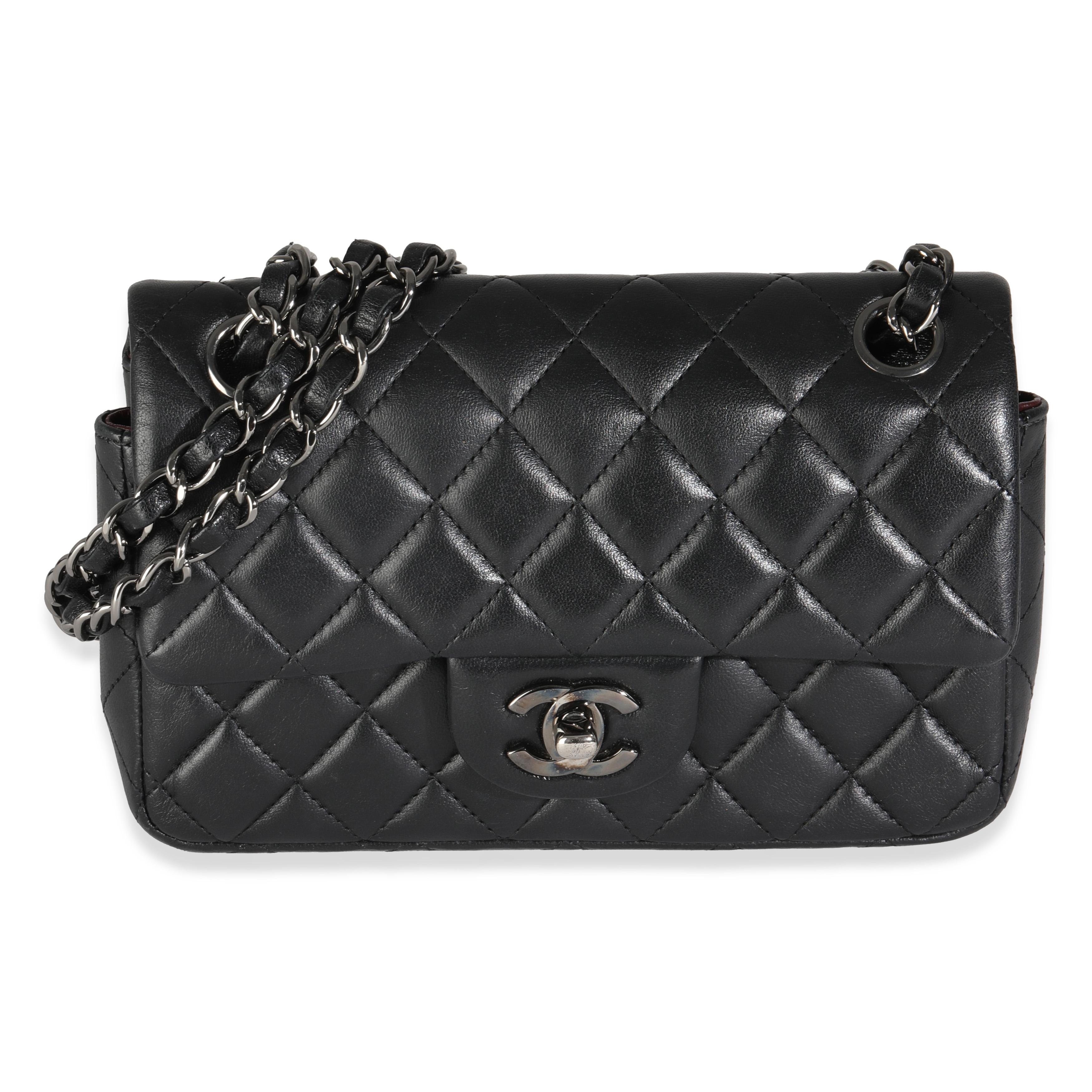 Listing Title: Chanel Black Quilted Lambskin Mini Rectangular Flap Bag
SKU: 144958
MSRP: 5000.00 USD
Condition: Pre-owned 
Condition Description: A timeless classic that never goes out of style, the flap bag from Chanel dates back to 1955 and has