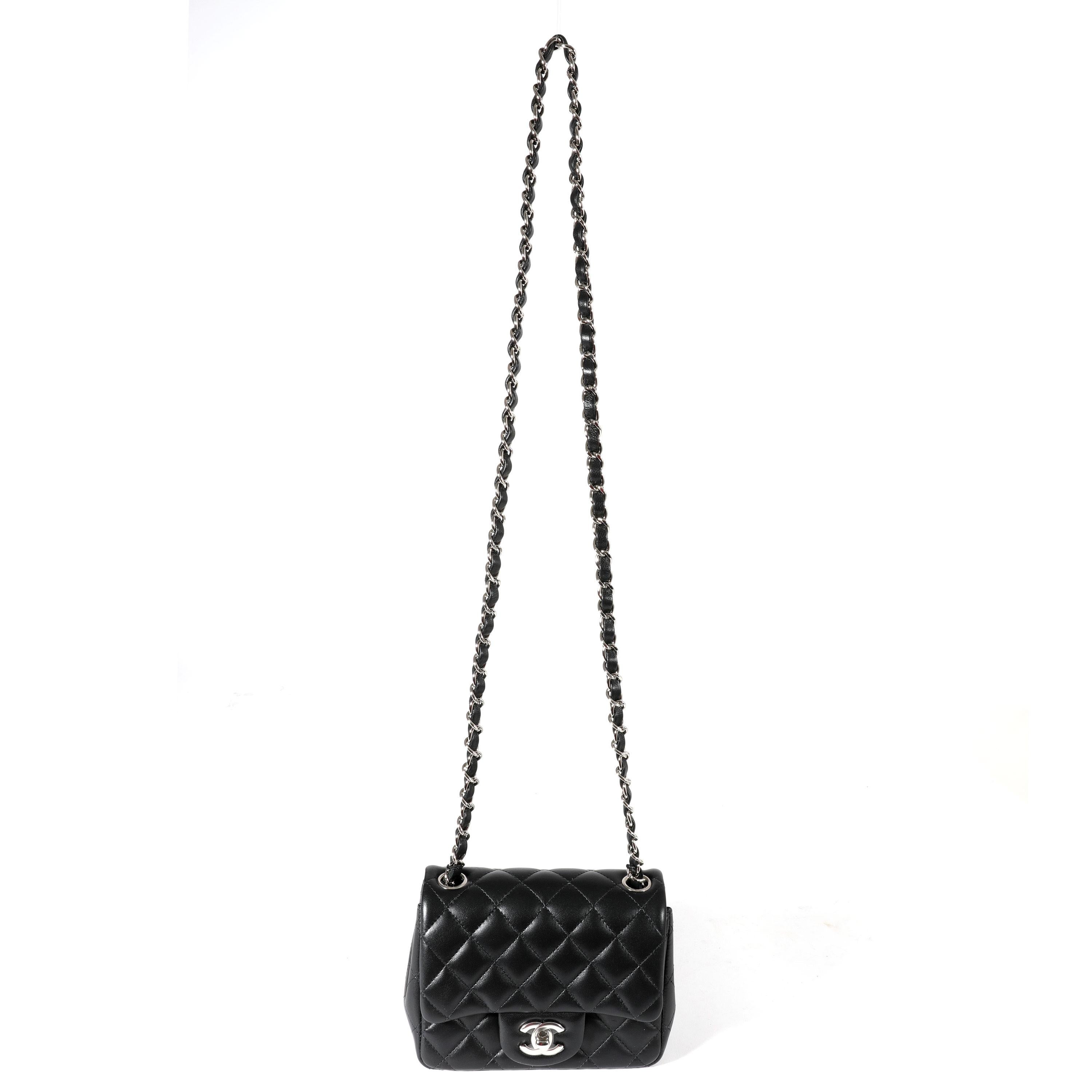 Listing Title: Chanel Black Quilted Lambskin Mini Square Classic Flap Bag
SKU: 123034
Condition: Pre-owned 
Handbag Condition: Mint
Condition Comments: Mint Condition. Plastic at some hardware. No visible signs of wear.  Final sale.
Brand: