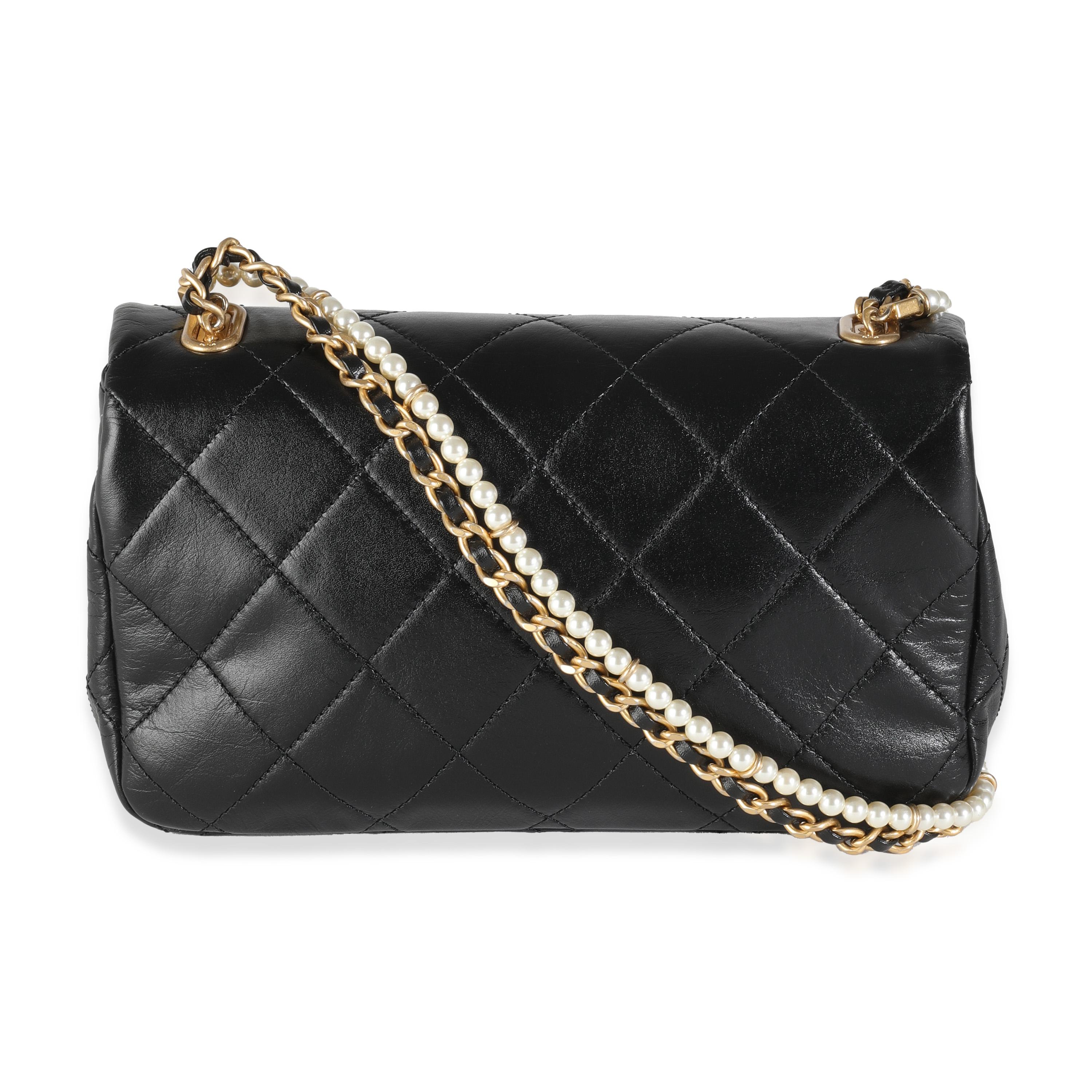 Listing Title: Chanel Black Quilted Lambskin Pearl Chain Mini Flap Bag
SKU: 144346
Condition: Pre-owned 
Condition Description: A timeless classic that never goes out of style, the flap bag from Chanel dates back to 1955 and has seen a number of