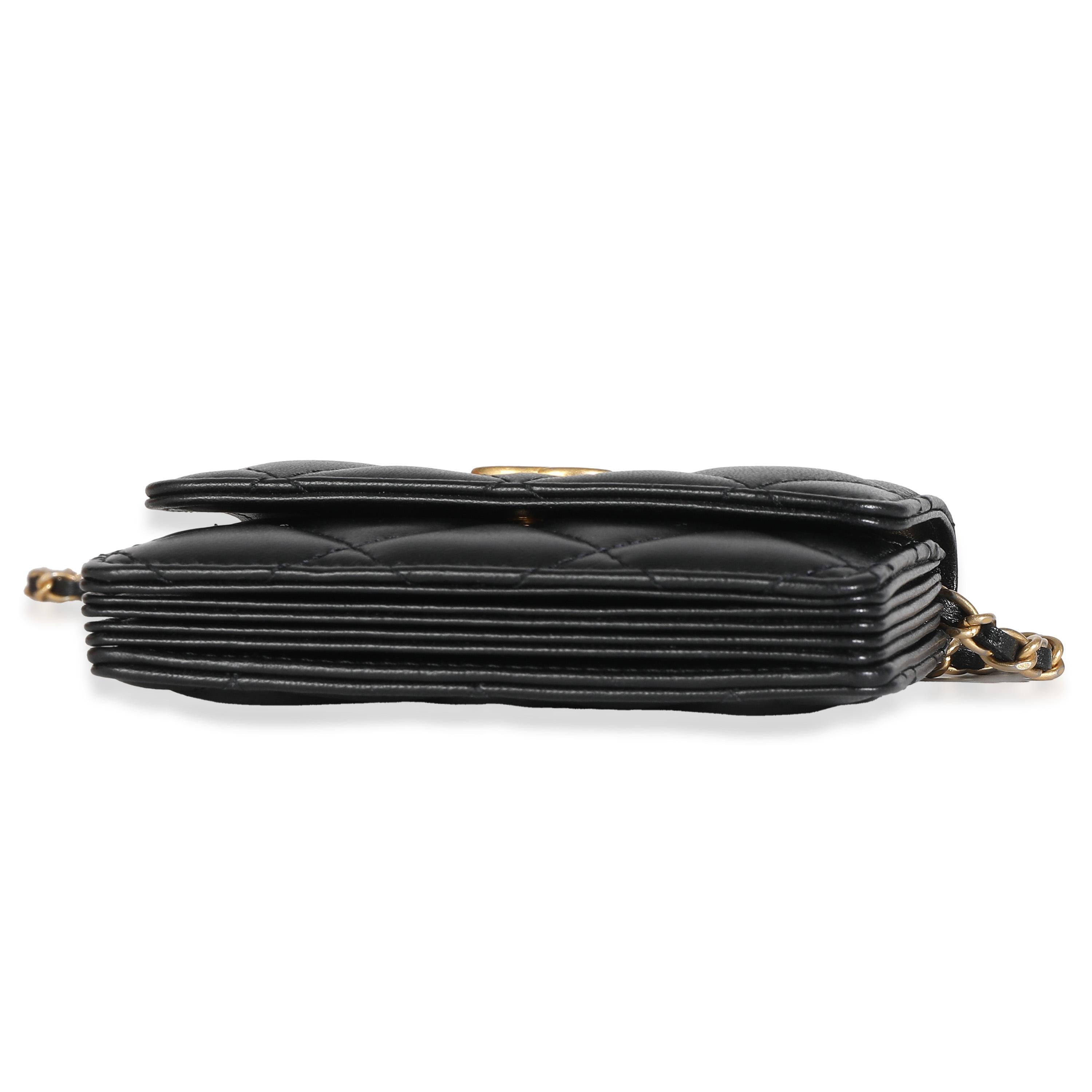 Listing Title: Chanel Black Quilted Lambskin Ruffled Card Holder On Chain
SKU: 137895
Condition: Pre-owned 
Handbag Condition: Excellent
Condition Comments: Item is in excellent condition and displays light signs of wear. Faint indentation along