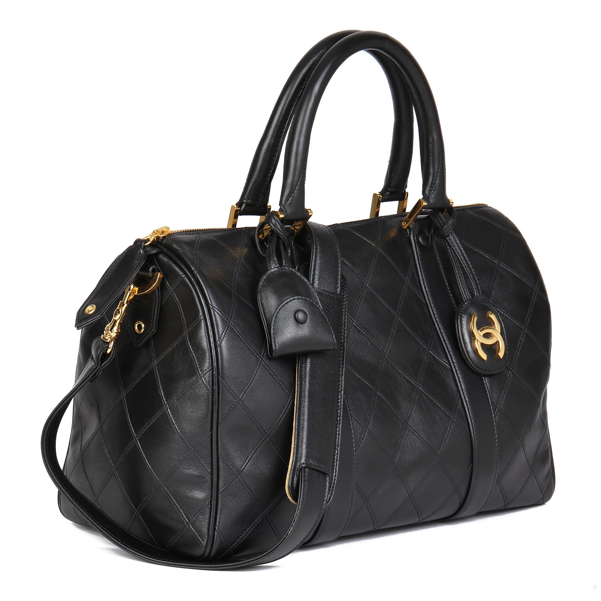 CHANEL
Black Quilted Lambskin Vintage Boston 35

Xupes Reference: HB4547
Serial Number: 4486525
Age (Circa): 1996
Accompanied By: Chanel Dust Bag, Authenticity Card, Padlock, Keys, Clochette, CC Charm, Shoulder Strap
Authenticity Details: