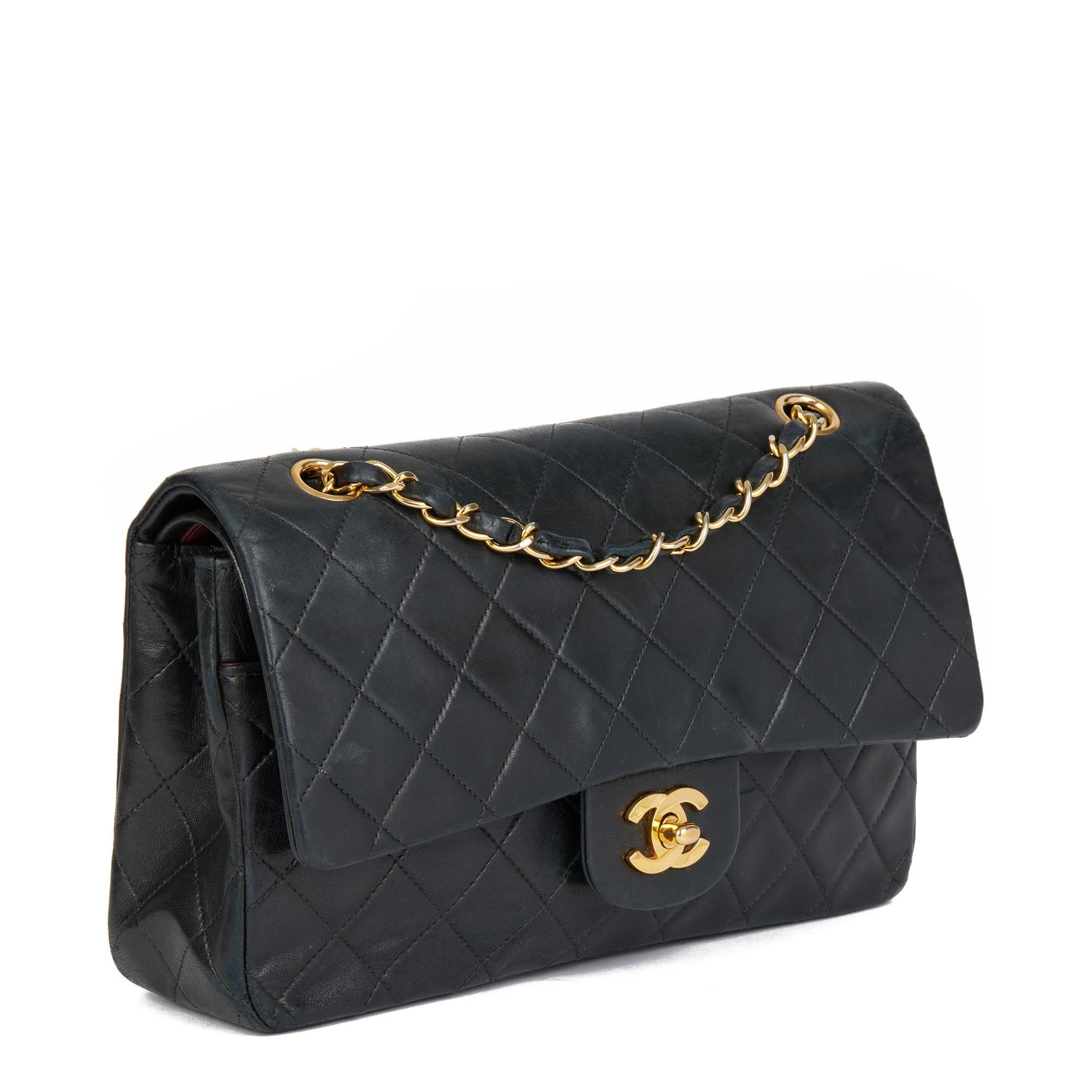 CHANEL
Black Quilted Lambskin Vintage Medium Classic Double Flap Bag

Serial Number: 53*****(Unreadable)
Age (Circa): 1997
Authenticity Details: Authenticity Card, Serial Sticker (Made In France)
Gender: Ladies
Type: Shoulder

Colour: