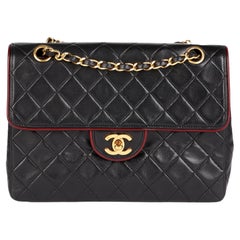 CHANEL Black Quilted Lambskin Vintage Medium Classic Single Flap Bag with Red Tr