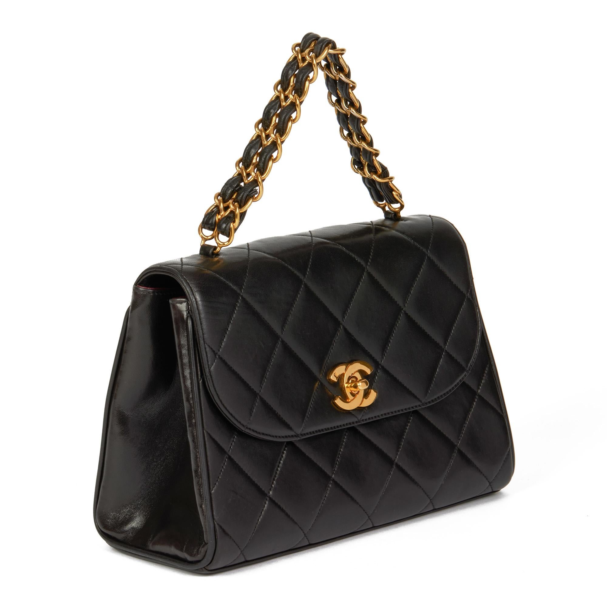 CHANEL
Black Quilted Lambskin Vintage Medium Classic Top Handle

Xupes Reference: HB4332
Serial Number: 3546956
Age (Circa): 1995
Accompanied By: Chanel Dust Bag
Authenticity Details: Serial Sticker (Made in France)
Gender: Ladies
Type: Top