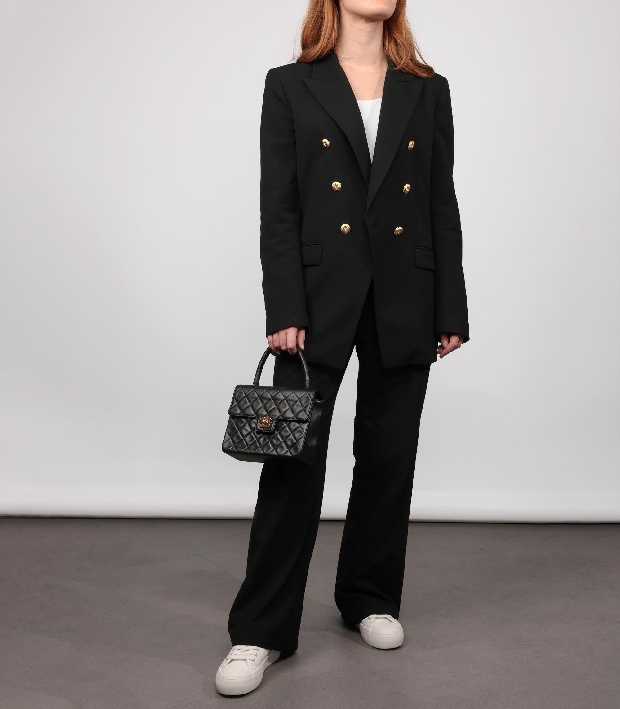 Chanel Black Quilted Lambskin Vintage Mini Classic Kelly

Product Details
Xupes Ref: HB5718
Brand: Chanel
Model: Mini Classic Kelly
Type: Top Handle
Serial Number: 2628733
Age: 1994
Accompanied By: Chanel Dust Bag, Authenticity Card
Colour: Black
