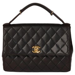 CHANEL Black Quilted Lambskin Vintage Mini Classic Top Handle Flap Bag