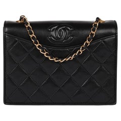 Chanel - Mini sac à main vintage en cuir d'agneau matelassé, à rabat unique et intemporel, noir