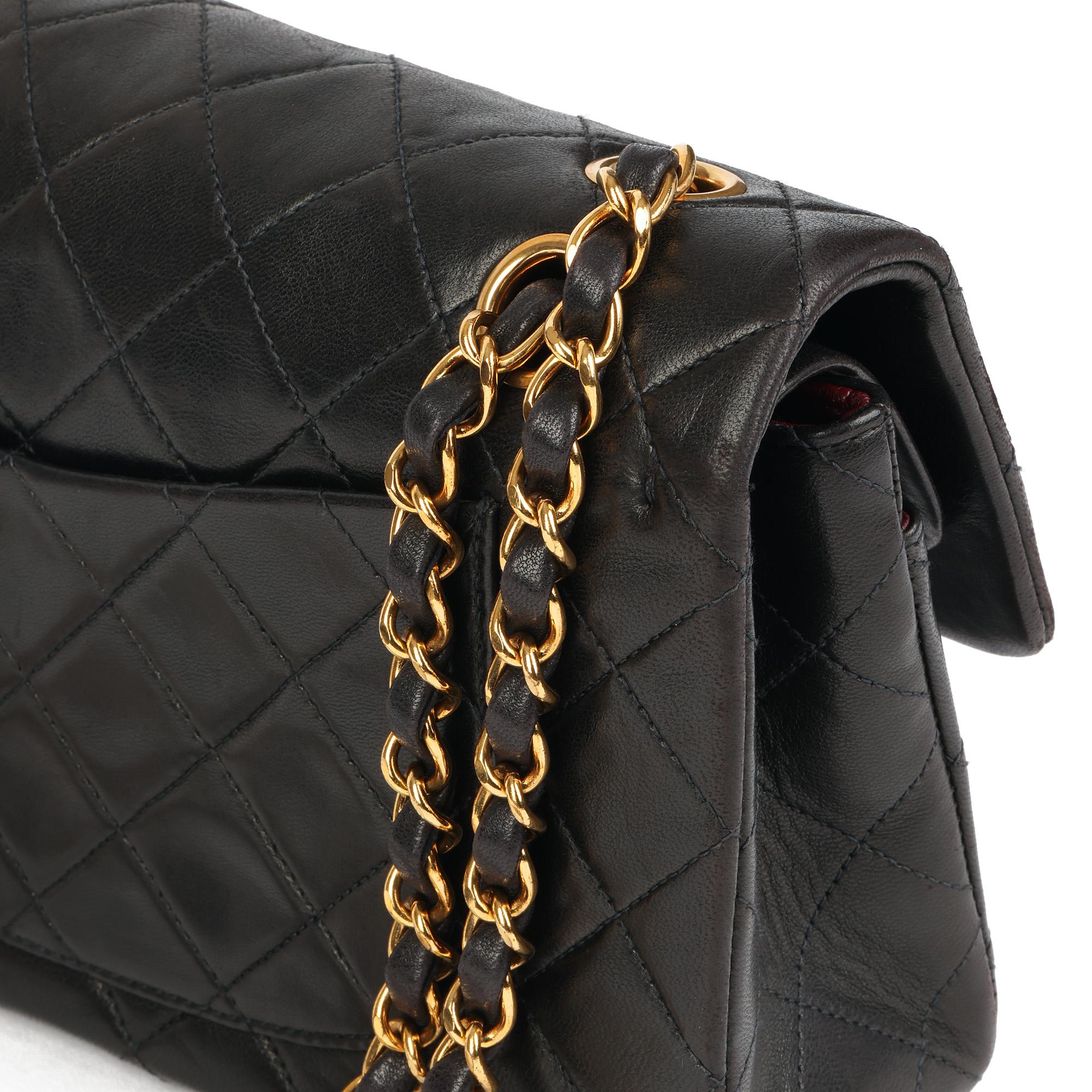 CHANEL
Black Quilted Lambskin Vintage Small Classic Double Flap Bag 

Serial Number: 3732982
Age (Circa): 1995
Accompanied By: Chanel Dust Bag, Box, Authenticity Card, Care Booklet
Authenticity Details: Authenticity Card, Serial Sticker (Made in