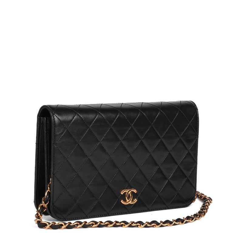 CHANEL
Black Quilted Lambskin Vintage Small Classic Single Full Flap Bag

Xupes Reference: HB5059
Serial Number: 5154939
Age (Circa): 1997
Accompanied By: Chanel Dust Bag, Box, Protective Felt, Authenticity Card
Authenticity Details: Authenticity