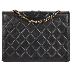 CHANEL Petit sac à rabat unique intemporel en cuir d
agneau noir matelassé vintage