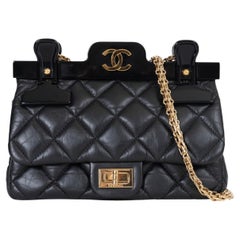 CHANEL black quilted leather 16K 2.55 REISSUE MINI HANGER FLAP Bag