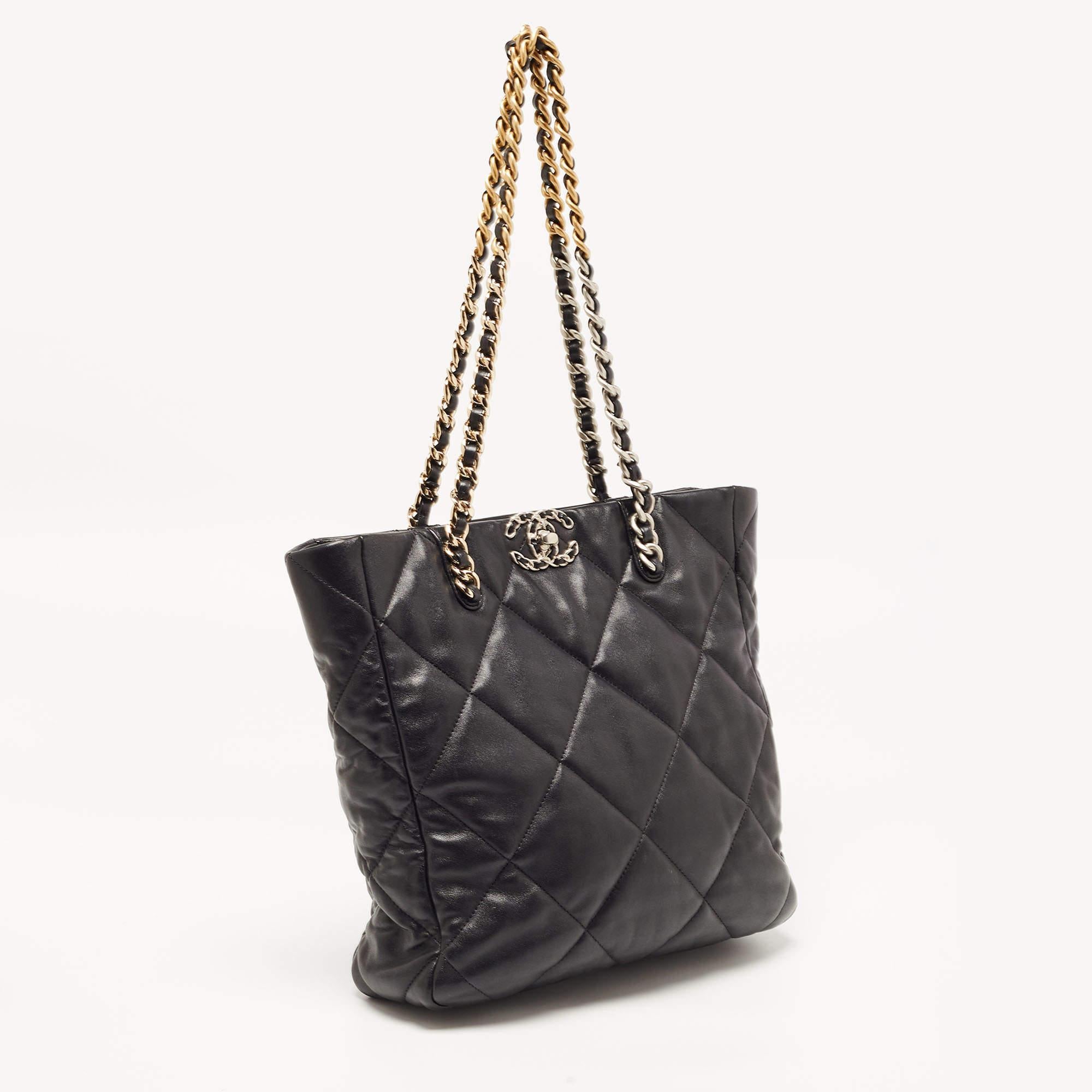 The Chanel 19 Shopper Tote exudes timeless elegance. Crafted from luxurious black quilted leather, it features the iconic Chanel 19 closure in gold-tone hardware. Spacious and versatile, this tote is a perfect blend of style and functionality,