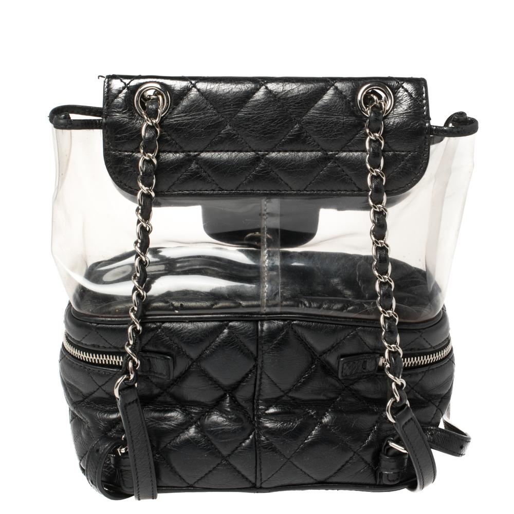 This Chanel Aquarium Backpack is a stunning piece from the Spring 2018 collection. The exterior combines quilted leather with clear PVC and silver-tone hardware. The bag showcases protective metal feet at the base. Carry it with the leather & chain