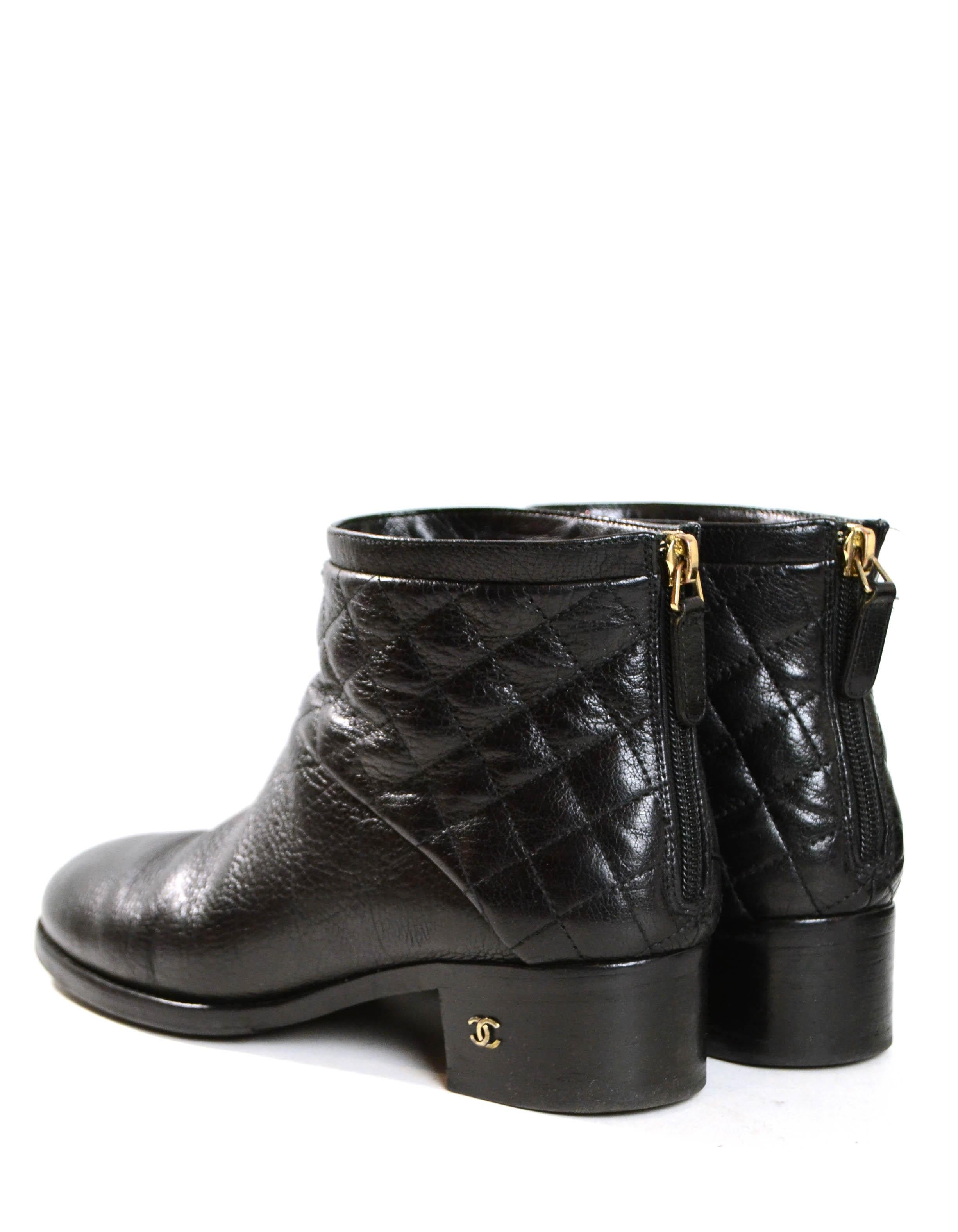 Chanel Black Quilted Leather Ankle Booties sz 38.5

Made In: Italy
Color: Black
Hardware: Silvertone
Materials: Leather
Closure/Opening: Back zip
Overall Condition: Very good condition with some scuffs to heels and light creasing to leather.  Rubber