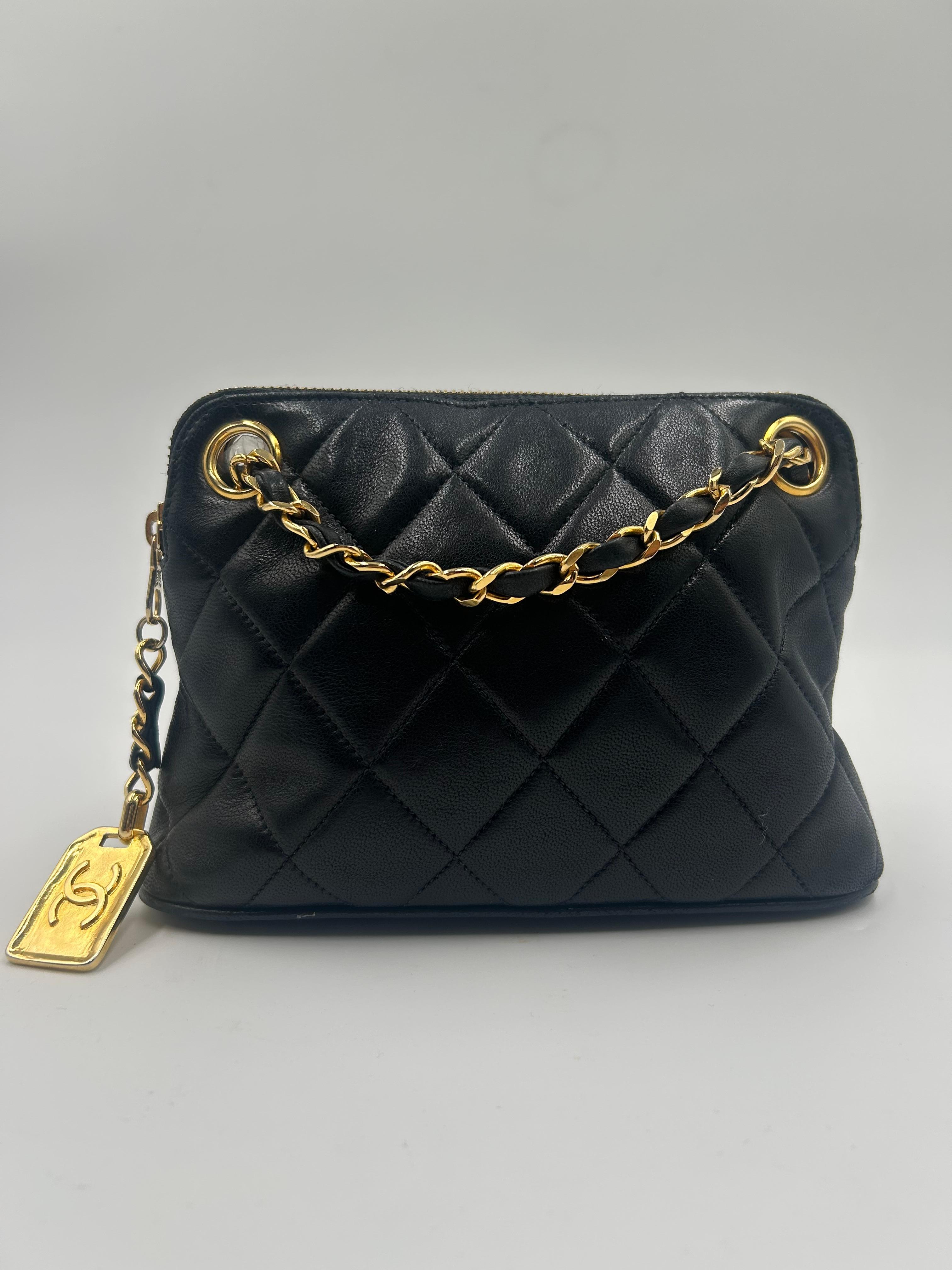 This Chanel bag is a timeless example of the brand’s iconic elegance and craftsmanship. Made from luxurious black quilted leather it features the signature gold-tone hardware that adds a touch of sophistication. The classic rectangular silhouette is