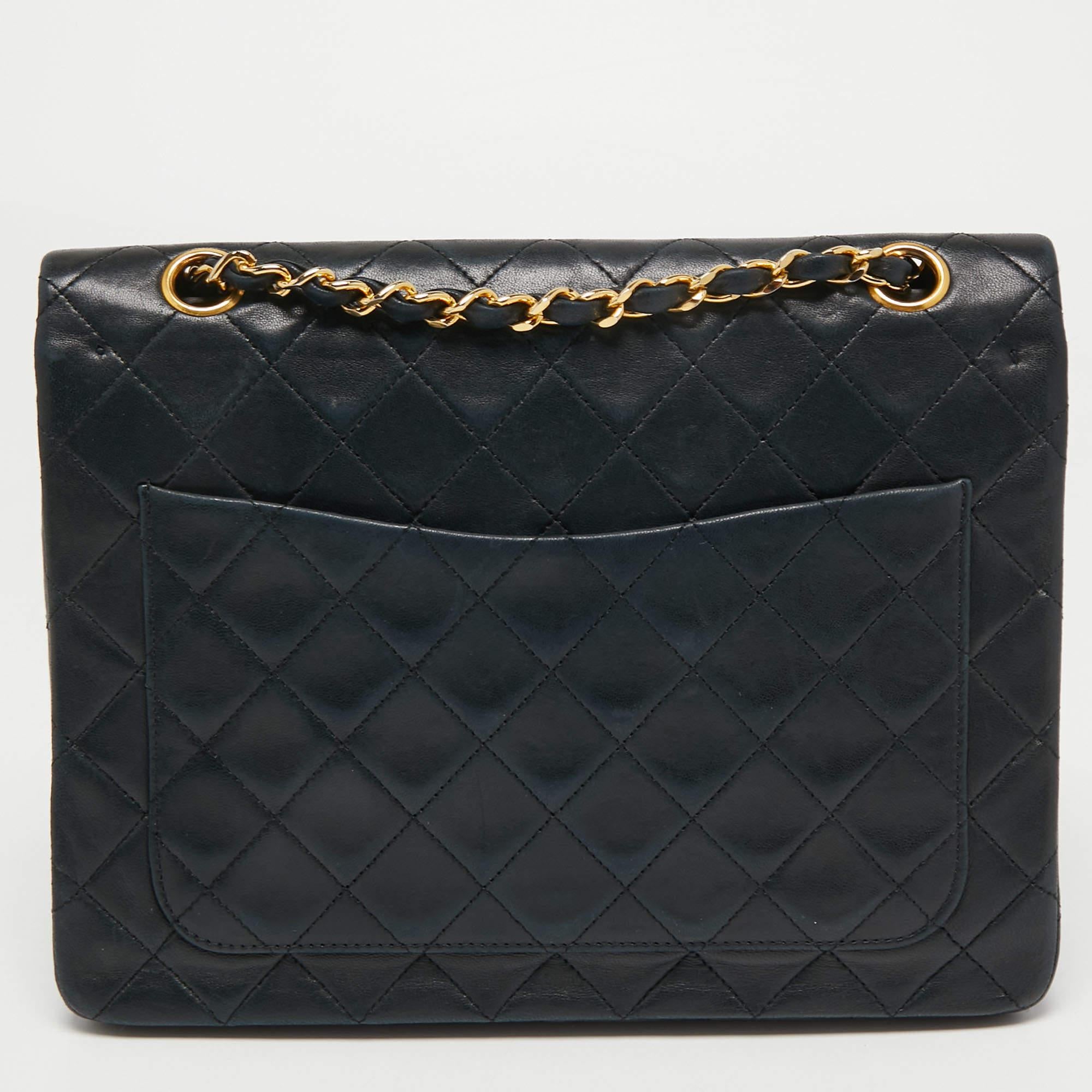 Chanel's luxurious Classic Flap bag is a must-have in a well-curated wardrobe! This stunning bag has a masterfully-crafted leather exterior with gold-tone hardware and the iconic CC logo on the front. This Classic Double Flap is complete with a