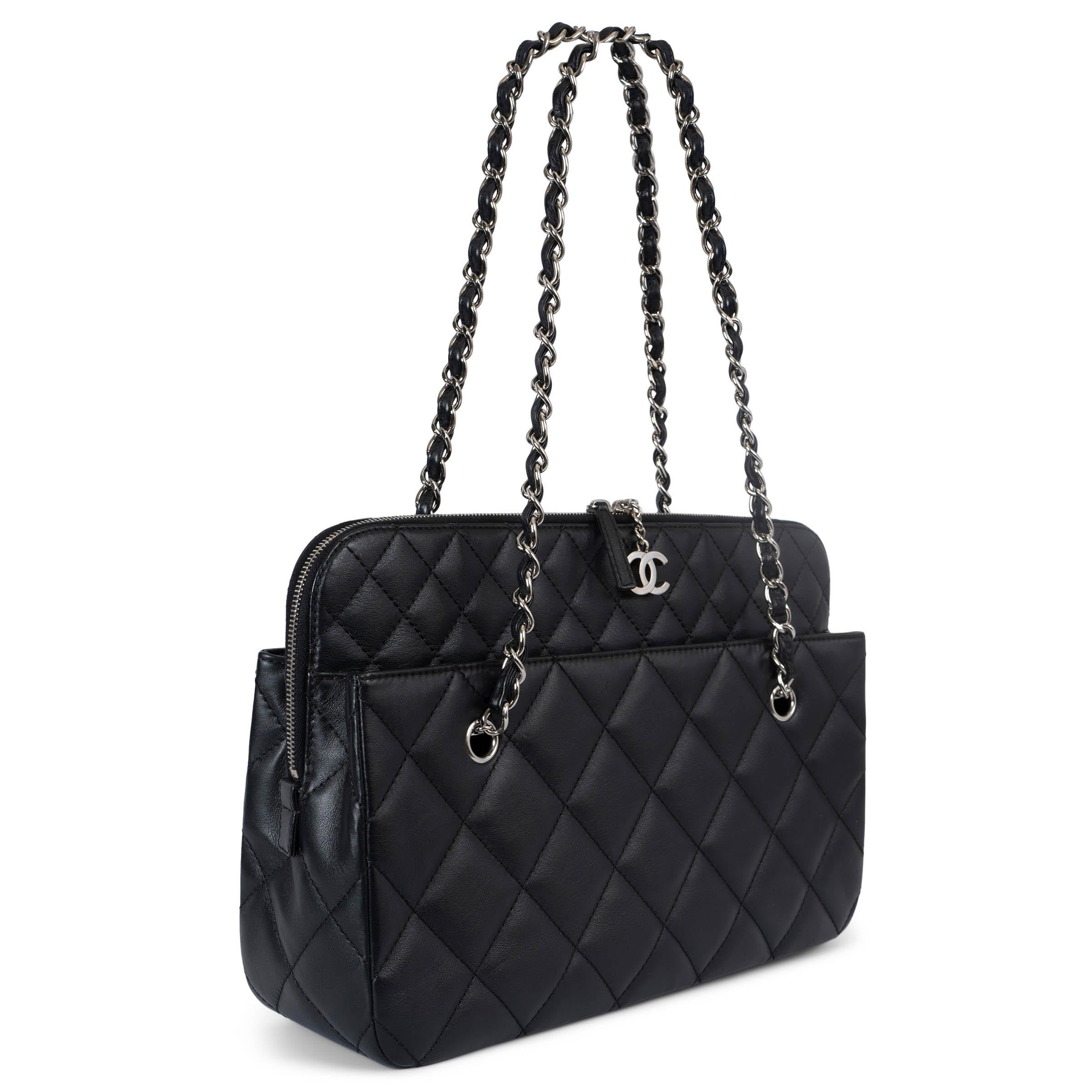100% authentic Chanel In The Business Large camera case bag in quilted black featuring silver-tone hardware, two large outise pockets, CC logo zipper pull and classic chain and leather shoulder straps. Lined in black canvas with one large zipper
