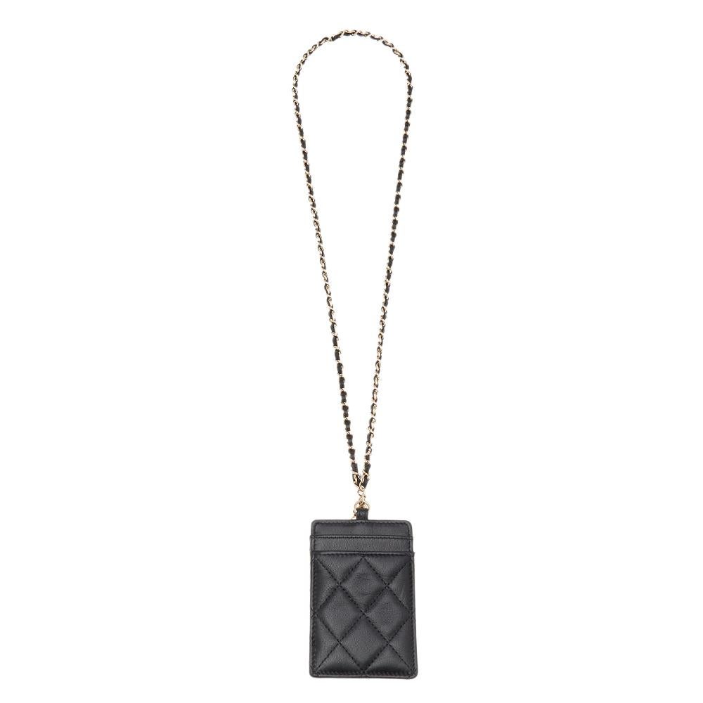 Let your regular accessories not be mundane anymore. Make them more interesting and lavish with this Infinity Lanyard ID card holder from the House of Chanel. It is made from black quilted leather, which is enhanced with distinct gold-toned