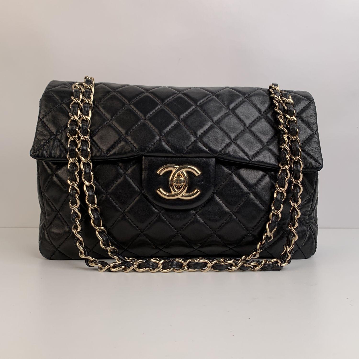 Chanel 'Jumbo' Timeless Classic Flap 2.55 Bag in black quilted leather. Period/Era: 2008-2009. It features double 'CC' turn lock closure and interwoven chain/leather straps; can be worn on the shoulder with double strap or lengthen to wear with one