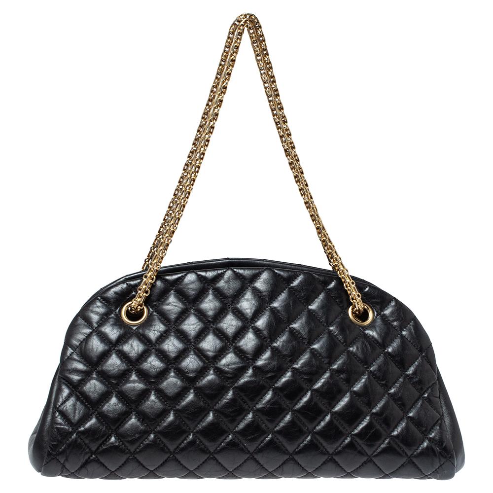 Spacious and captivating, this Just Mademoiselle Bowler bag is from Chanel. It has been crafted from leather and features the iconic quilted pattern all over. It is equipped with two chain handles and well-sized canvas compartments to keep your