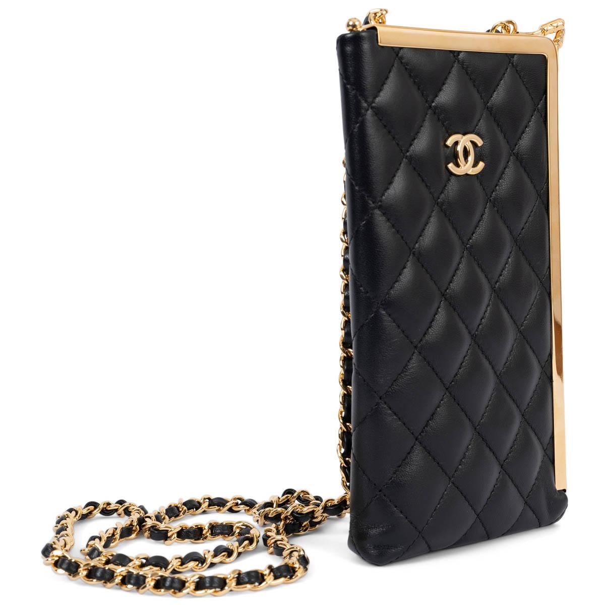 100% authentic Chanel kisslock frame clutch on chain in black lambskin leather featuring gold-tone metal hardware. Lined in black leather with one credit card slot. Has been carried once or twice and shows faint pressmarks from the chain on the