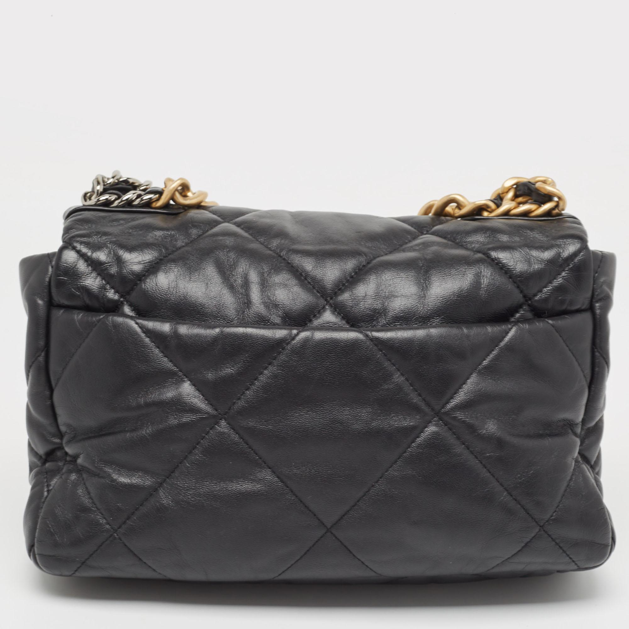 The house of Chanel offers this beautiful 19 flap bag in black to help you create timeless style edits every season. Crafted with quality materials, this piece will last you a long time.

Includes: Original Dustbag

