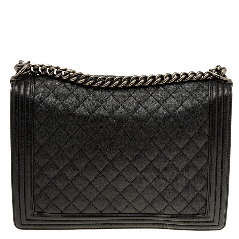 Eyed by women worldwide, Chanel's luxurious Boy Flap bag is a must-have in your closet! The stunning bag is made from black leather and has the everlasting quilted pattern. It features sturdy hardware, the iconic Boy CC logo on the flap, and an