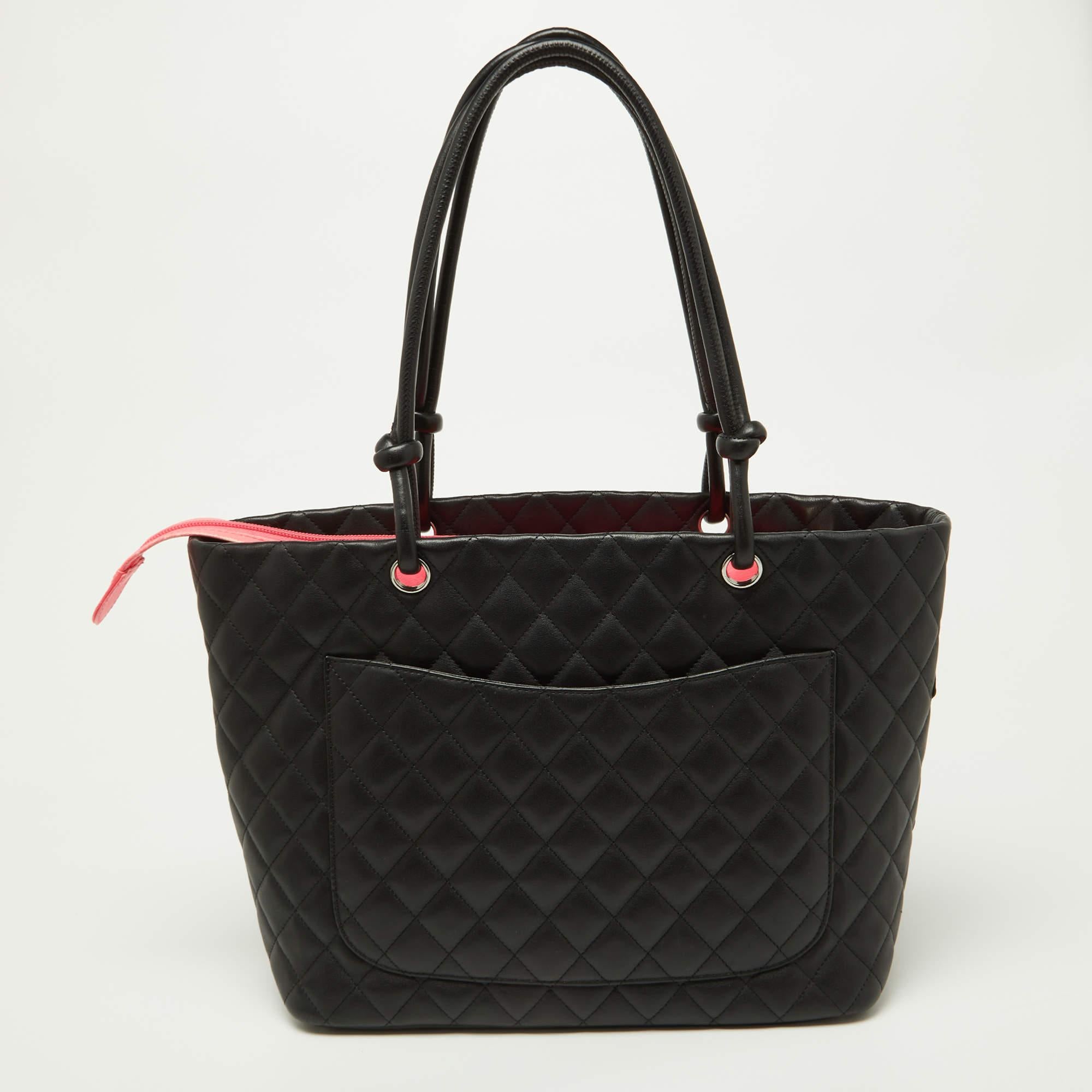 Perfect for work or travel, this Chanel tote is made of quilted leather to be classy and durable. It has knotted shoulder handles, a front CC logo, and a spacious lined interior.

