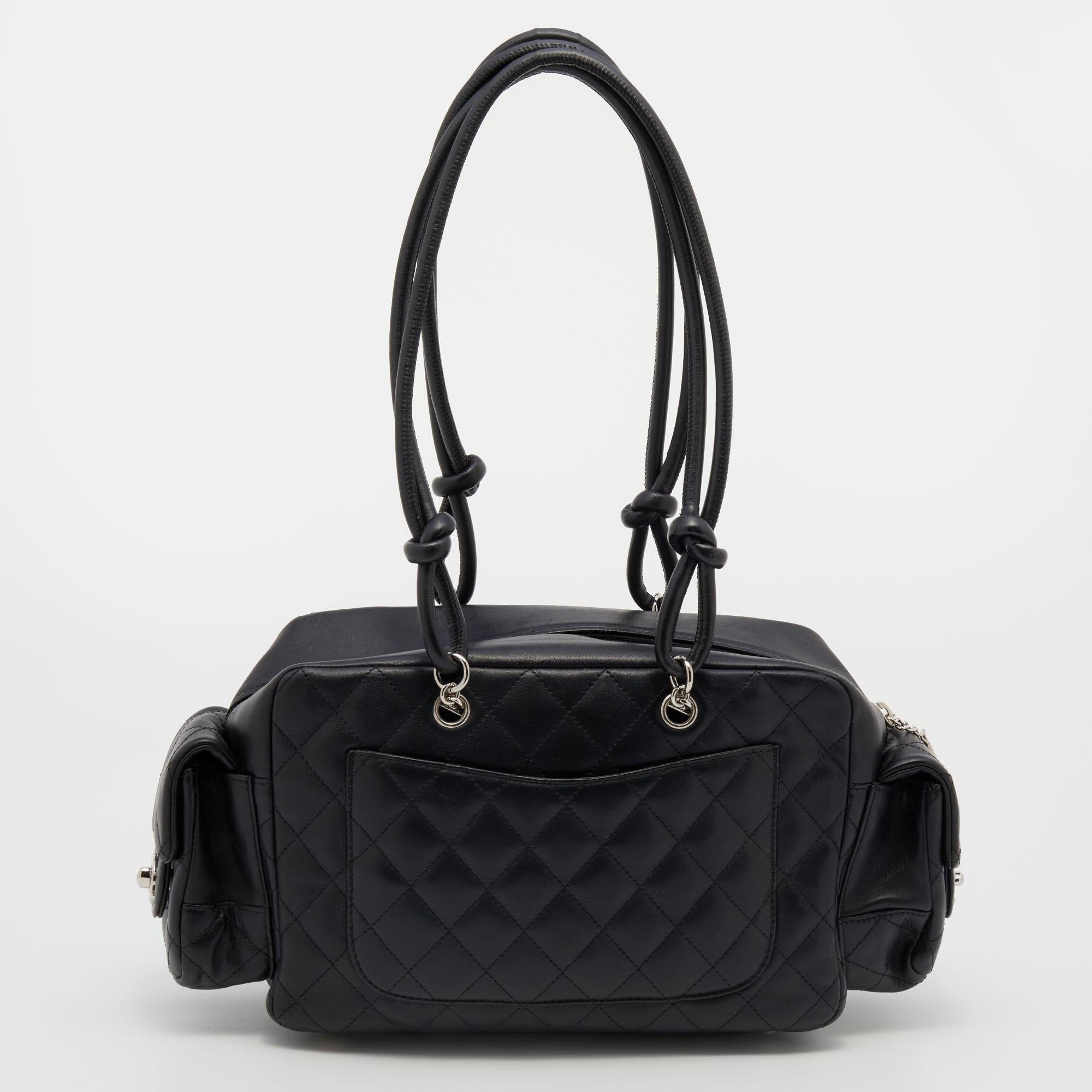 This Reporter bag is just as grand as the other Chanel handbags. Exquisitely crafted from leather into a functional design, it is added with the CC logo and multiple pockets. The two handles allow a shoulder carry option and the lined interior