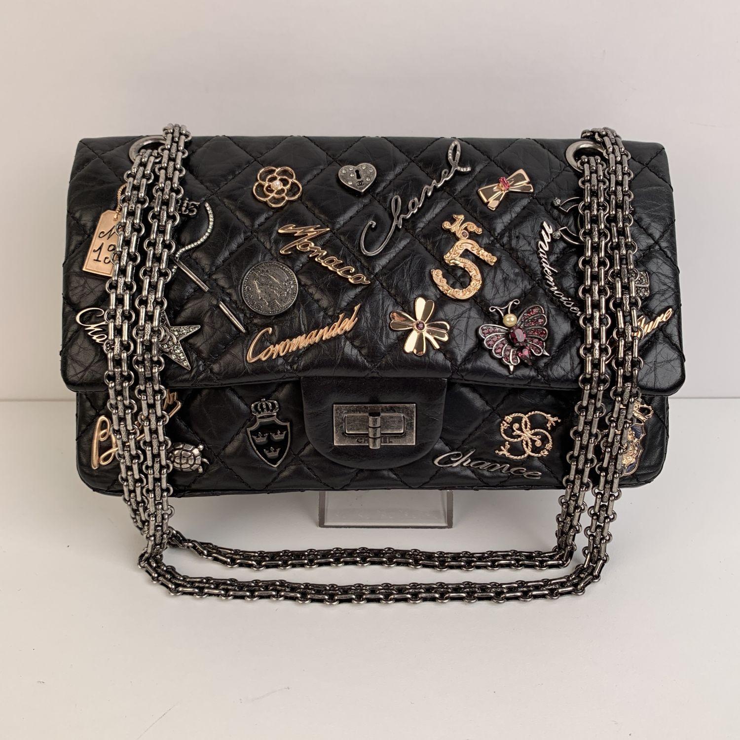 Beautiful Chanel '2.55 Reissue Flap Limited Edition - Lucky Charms' Shoulder Bag. The bag is crafted in black quilted leather embellished with different Chanel iconic metal charms applications. It features the Mademoiselle turnlock closure and