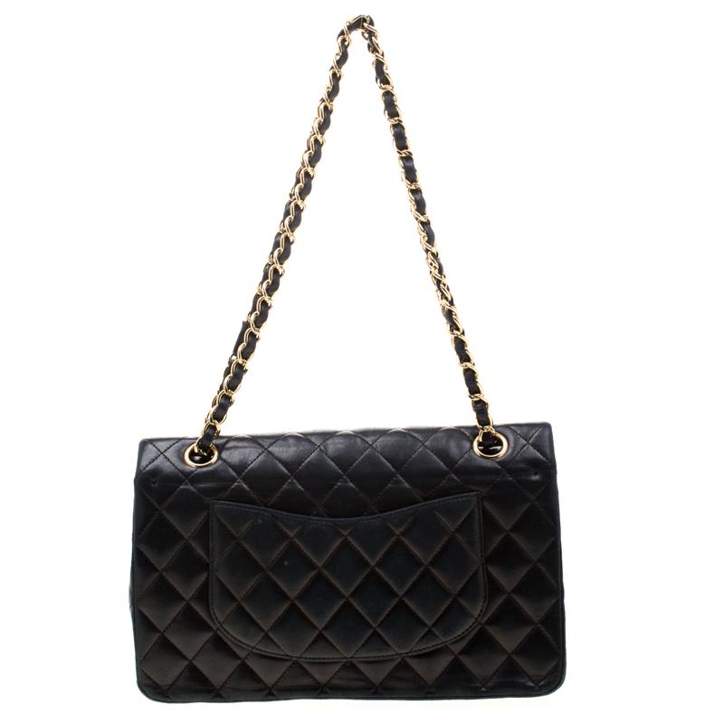 Chanel's Flap bags are iconic and monumental in the history of fashion. This classic single flap bag is crafted from black leather and features the iconic quilted pattern. It has dual chain and leather interwoven handles along with the CC twist lock