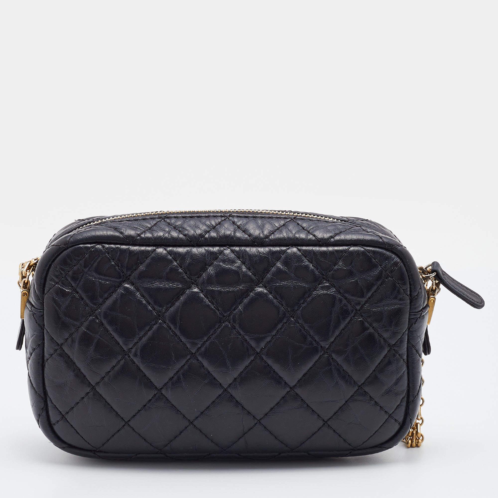 Introduce Chanel's irreplaceable style to your closet with this Reissue Camera bag. Crafted using leather, the bag has a signature quilted exterior, iconic House motifs on the front, and a leather-lined interior. Complete with a chain link, this bag