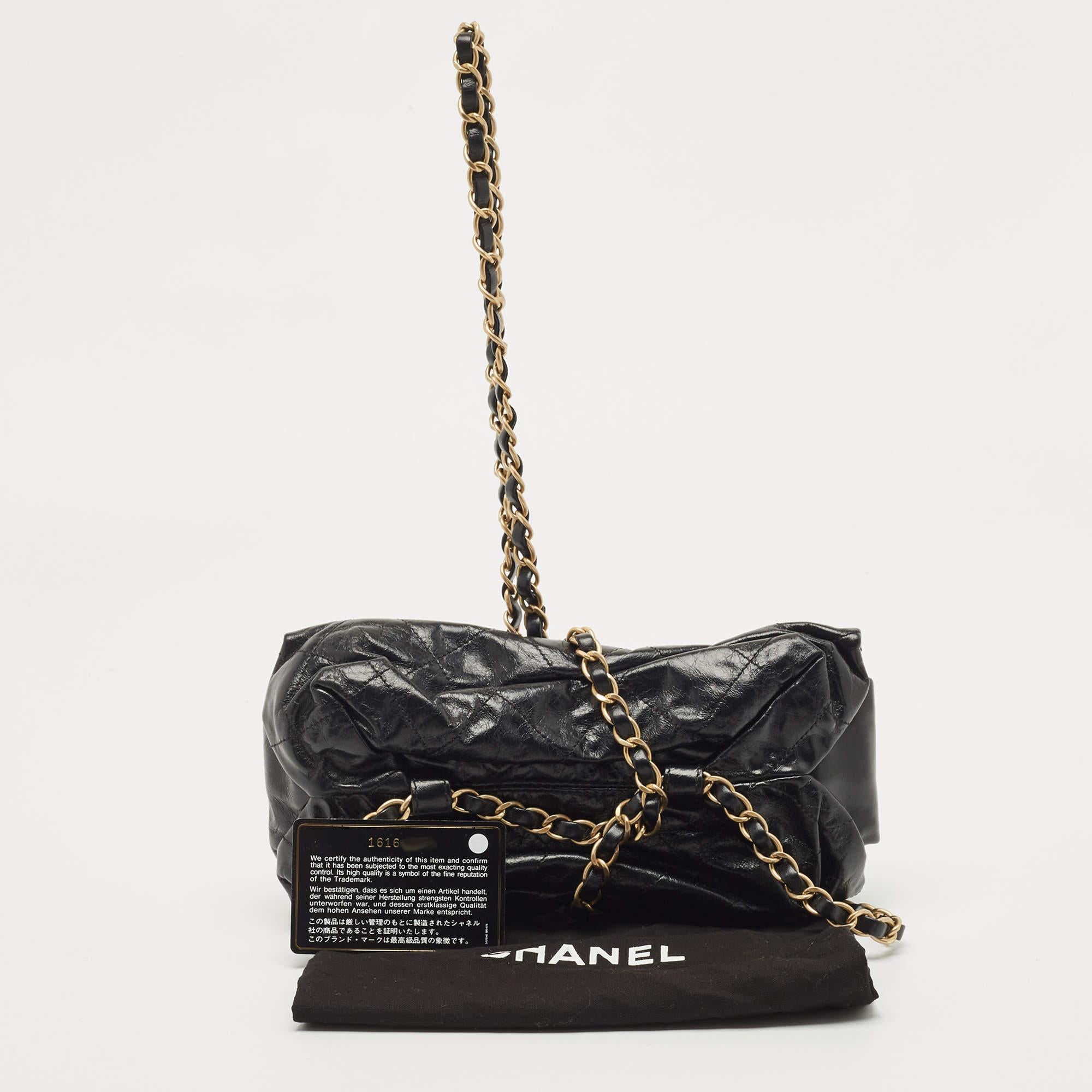 From one of the most popular line of Chanel, this bag features a caged construction with interwoven chain links elevating the black quilted upper. With signature elements displayed on the bag, it will add a refined touch to your ensemble.

