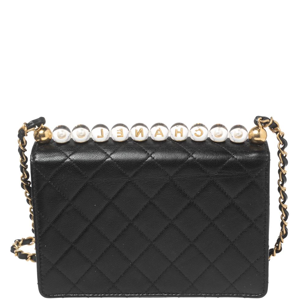 Indulge in Chanel's ever-classic charm with this flap shoulder bag. It is constructed using quilted leather and the top embellishments give it a luxurious update. Signature elements, interwoven shoulder handle, and lined interior ensure the aspect
