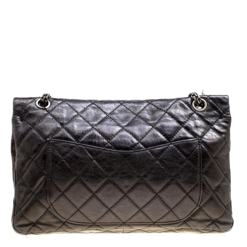 Every Chanel creation carries an irreplaceable style, like this stunner, Reissue 2.55 Classic 227 flap bag. It has been exquisitely crafted from classic black leather in their signature quilted pattern. It comes with a leather-lined interior that