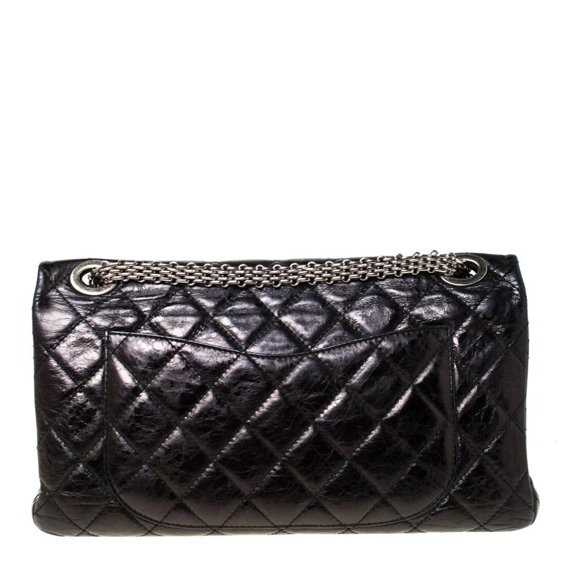 Chanel's Flap Bags are iconic and noteworthy in the history of fashion. This Reissue 2.55 is a buy that is worth every bit of your splurge. Exquisitely crafted from black leather, it bears their signature quilt pattern and the iconic Mademoiselle