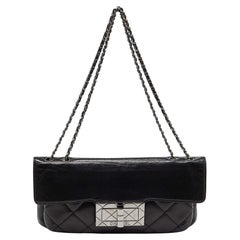 Chanel - Sac à rabat en cuir matelassé Reissue - noir