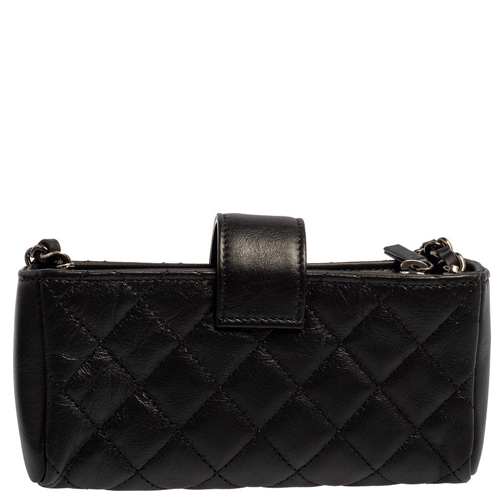 Presenting a phone holder with a fine mixture of charm and utility. This creation from Chanel is a splendid pick. It features a black leather body with signature motifs, a CC-detailed flap, and a well-sized interior to carry your phone. The phone