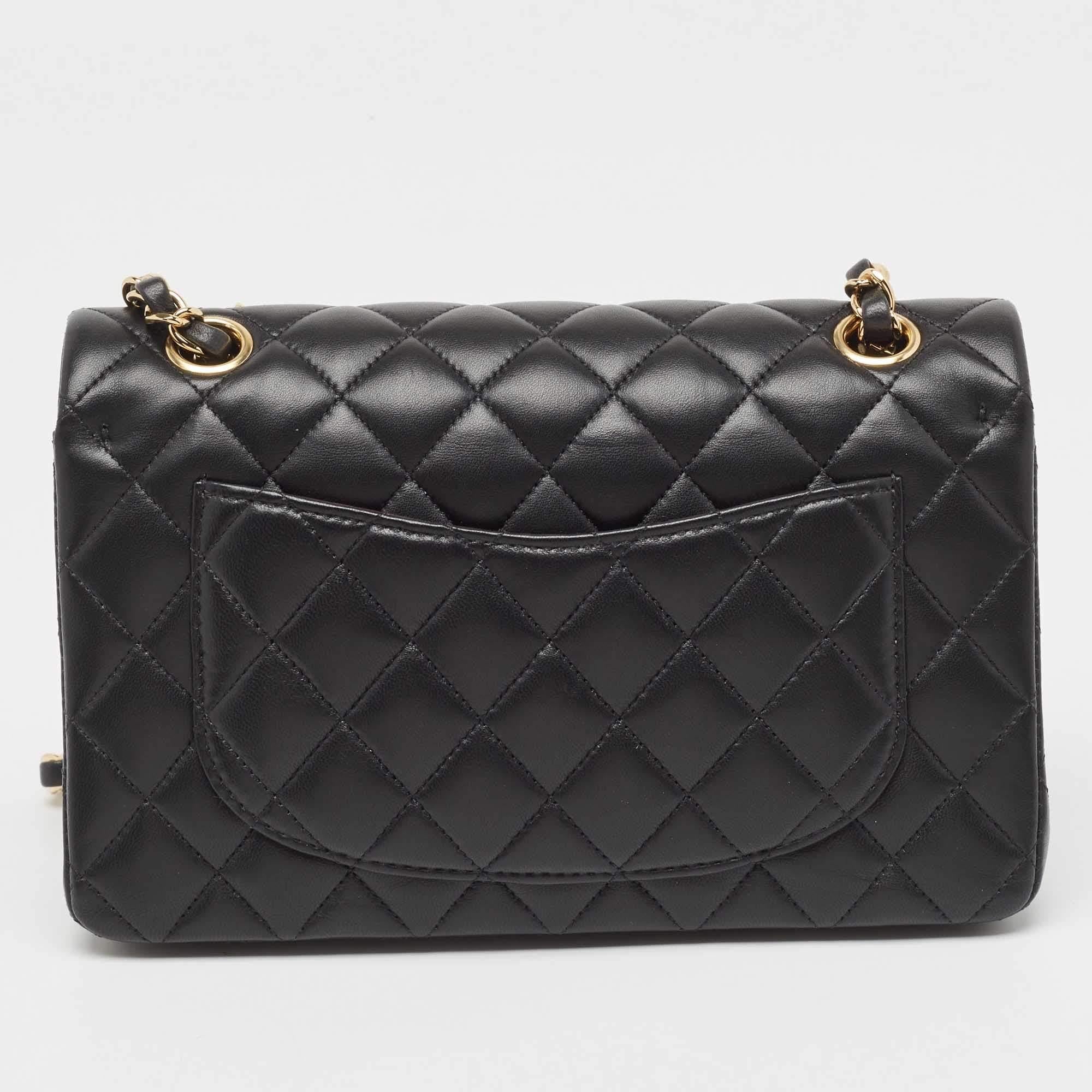 Crafted from sumptuous black quilted leather, the Chanel Classic Double Flap Bag exudes timeless charm and luxury. Its iconic silhouette, adorned with signature gold-tone hardware, offers both style and functionality. With a versatile chain strap,
