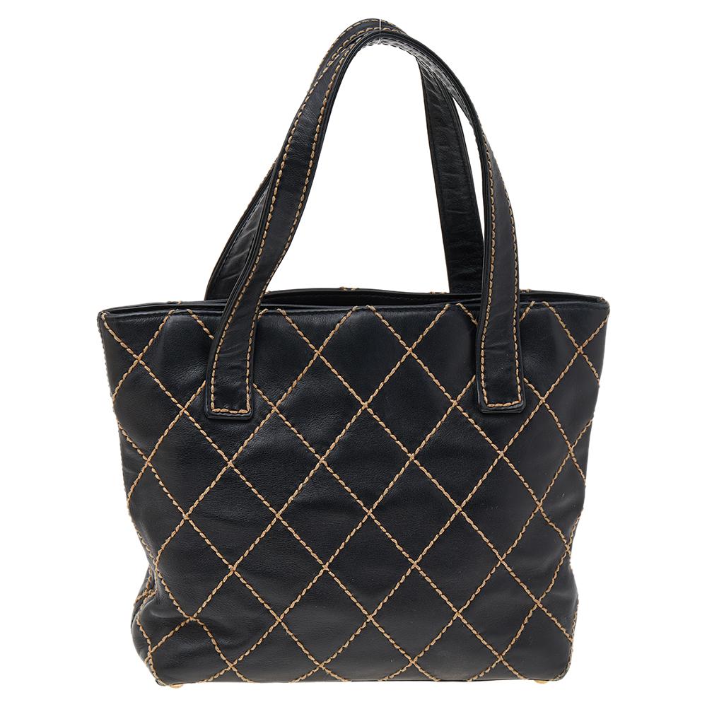 Cruise in style with this fabulous tote from Chanel. Beautifully crafted from leather and styled with a quilted exterior, this black creation is simple in design. It comes with a fabric interior that is sized to carry all your belongings and it is