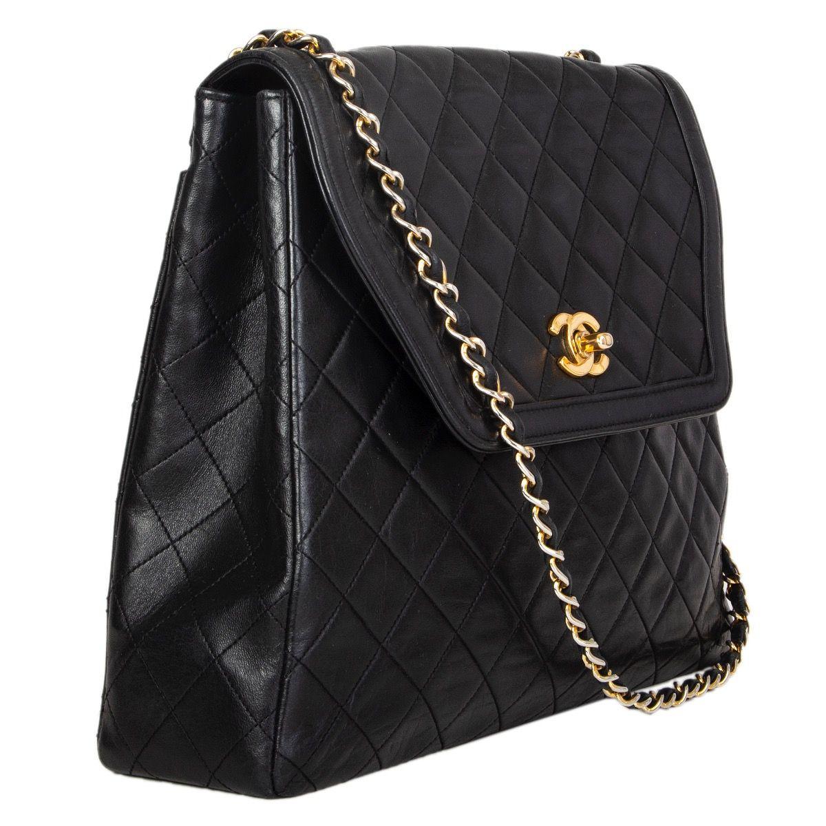 Chanel Vintage trapeze shaped flap bag in black quilted leather with a open pocket on the back side. Opens with a 'CC' turn-lock and is lined in burgundy leather with one open pocket against the back. Has been carried with signs of wear allover