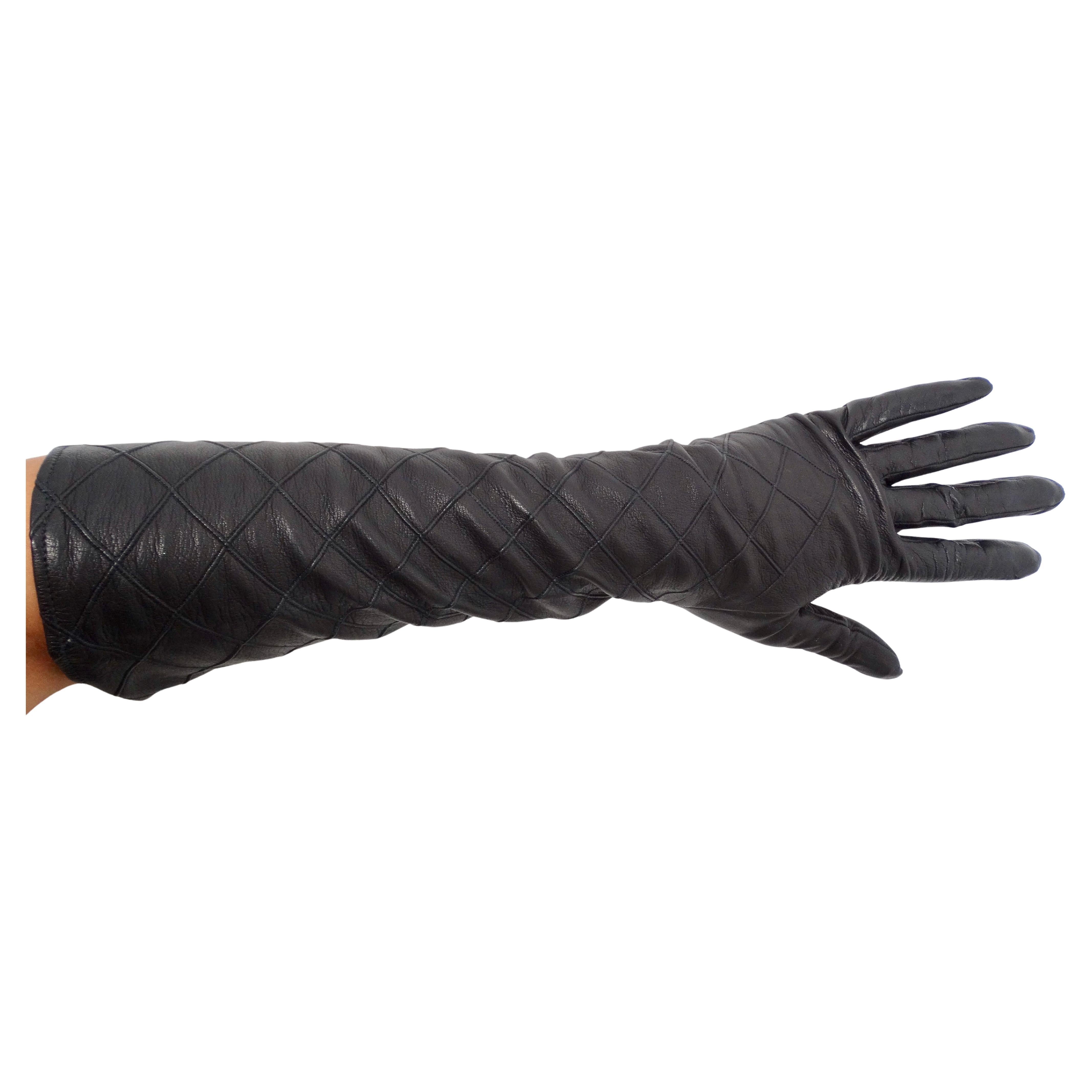 The Chanel Black Quilted Long Leather Gloves from the circa 1990s epitomize timeless elegance and sophisticated style. Crafted from luxurious black leather, these gloves feature signature quilted detailing that reflects Chanel’s iconic design
