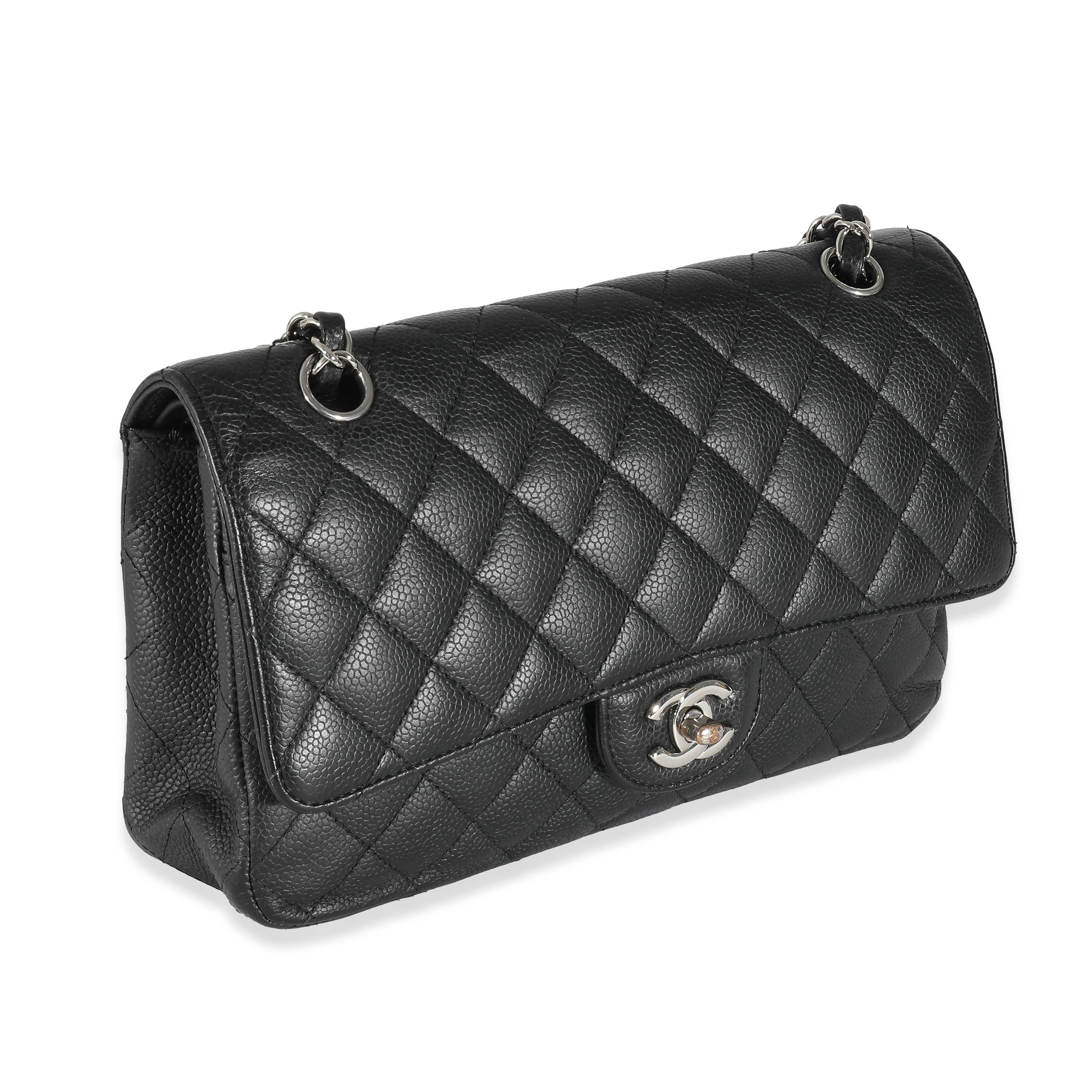 Listing Title: Chanel Black Quilted Caviar Medium Classic Double Flap Bag
SKU: 134796
Condition: Pre-owned 
Condition Description: A timeless classic that never goes out of style, the flap bag from Chanel dates back to 1955 and has seen a number of