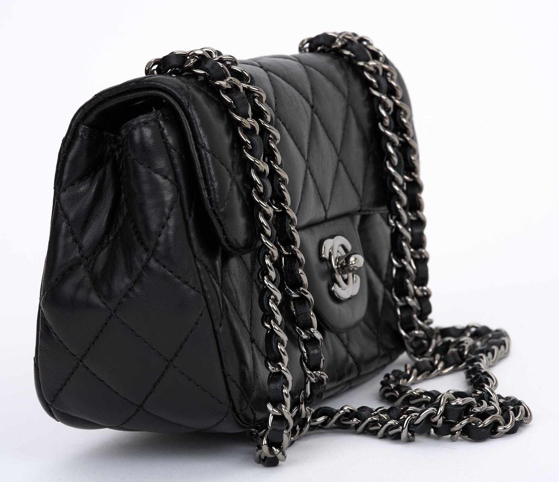 This Chanel Quilted Mini Flap bag features black leather calfskin, ruthenium hardware, chain-link shoulder strap, turn lock closure. Dust cover and ID card included. First two hologram numbers are 17.
Strap Drop - 11