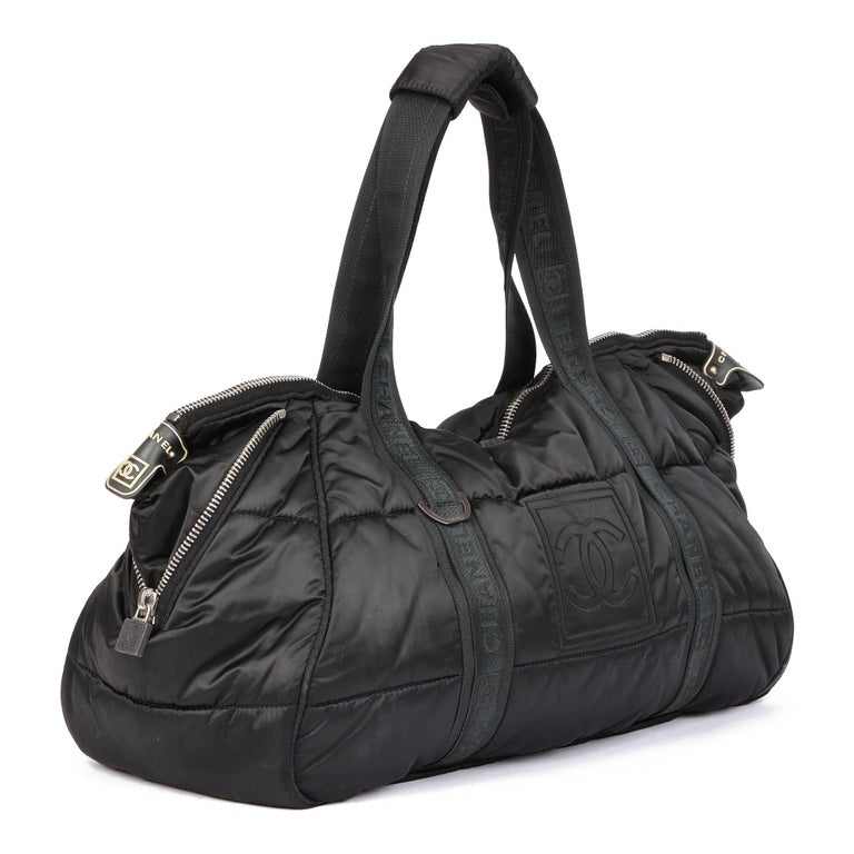 CHANEL
Black Quilted Nylon Coco Niege Sports Gym Tote

Serial Number: 10307182
Age (Circa): 2005
Authenticity Details: Serial Sticker (Made in Italy)
Gender: Ladies
Type: Tote

Colour: Black
Hardware: Silver
Material(s): Nylon
Interior: Beige