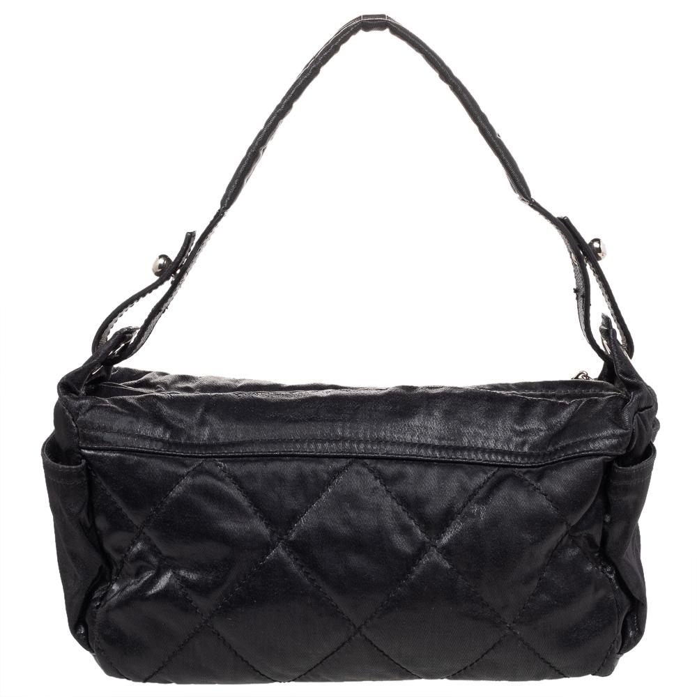Chanel's Biarritz hobo is designed in a black nylon body and covered in quilting. It comes with side pockets for easy access, a CC logo zipper pull, and a shoulder handle. The creation can hold all your daily essentials with ease.


