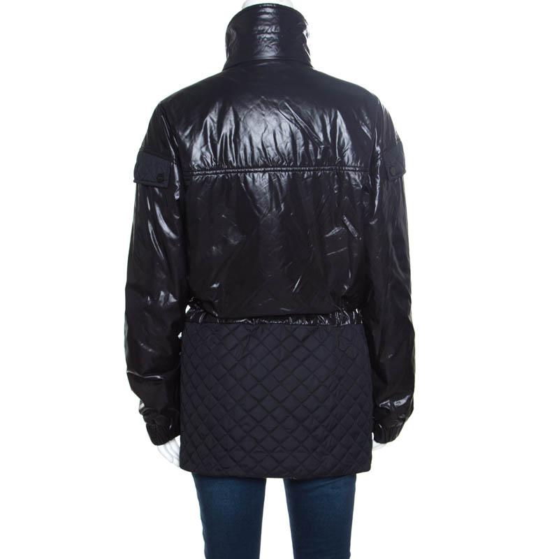 This jacket from Chanel is one item your closet will love. Made from quality materials, it carries quilt panels, a full front zipper, and the top section has a puffer style. Complete with a tie closure, this number is a must-buy.

Includes: The