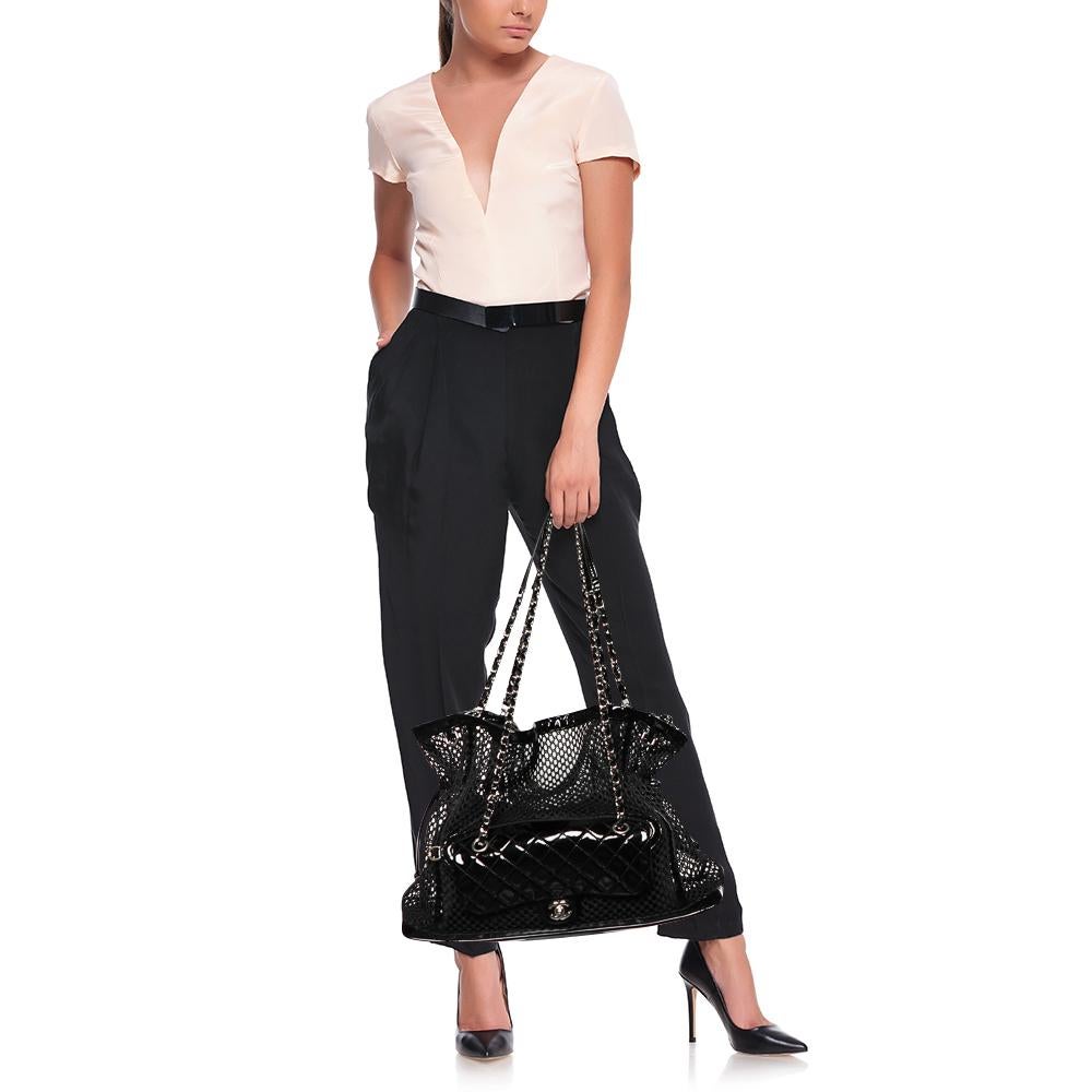 The Chanel tote is ideal for those who commute daily, loves shopping, and travels often. Made from patent leather and mesh, the creation is highlighted with silver-tone hardware and dual handles. The spacious interior makes it a