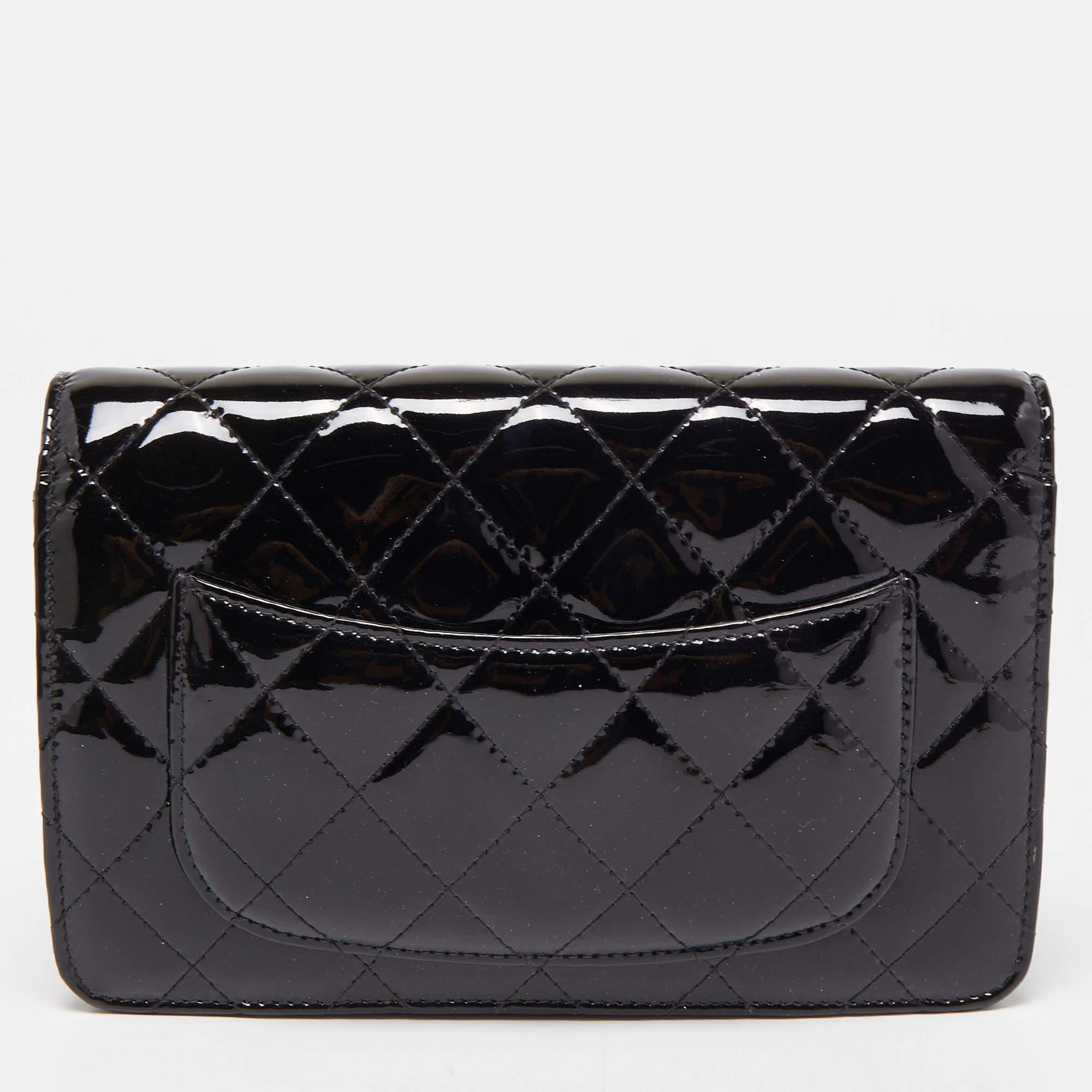 Trust this Chanel WOC to be light, durable, and comfortable to carry. Crafted from patent leather, it comes in a black shade. It features an ample interior, a long chain strap, and the CC logo at the front.

Includes: Authenticity Card, Info Booklet
